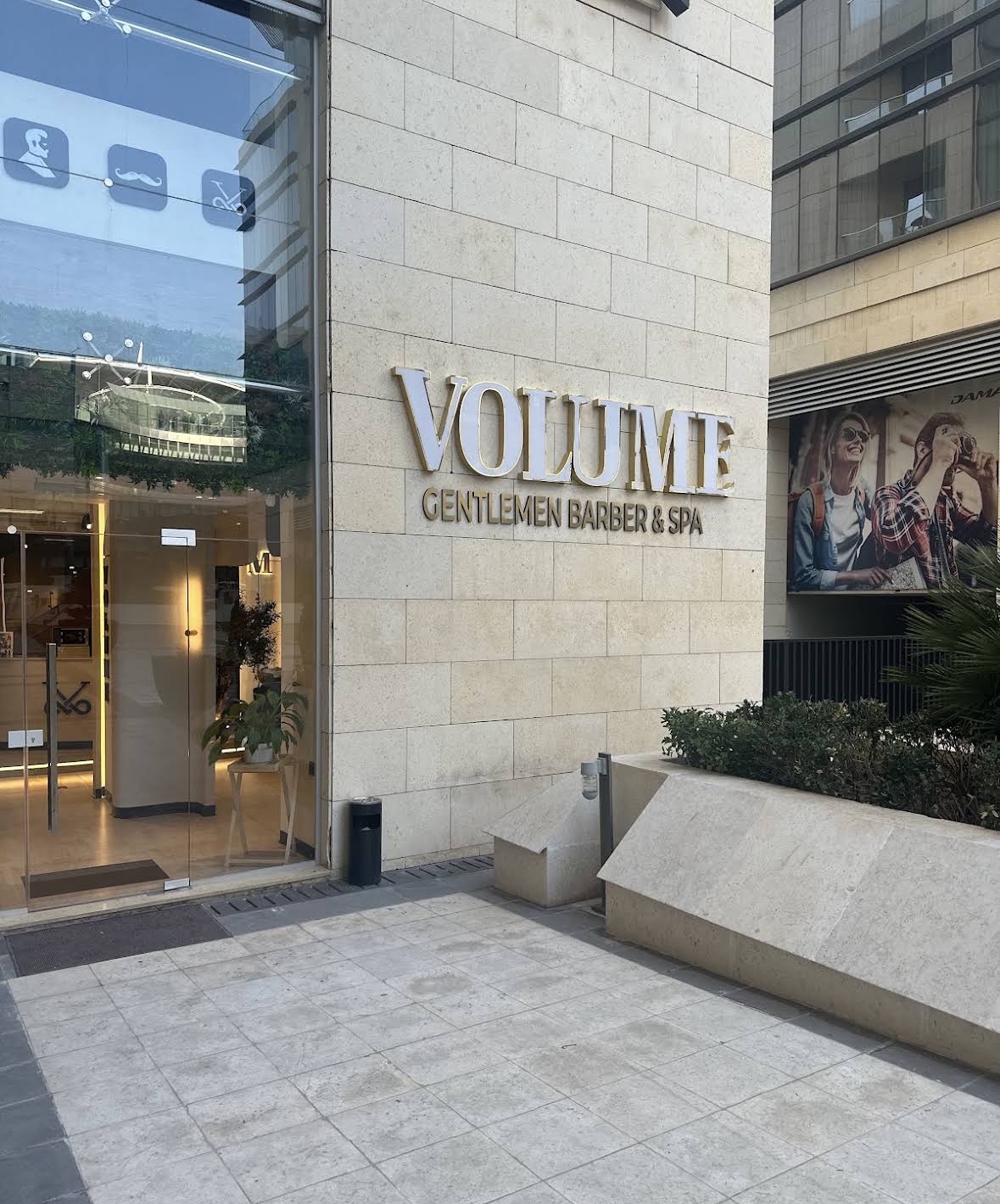 Volume Gentlemen Barber & Spa storefront signage on Istithmar Street